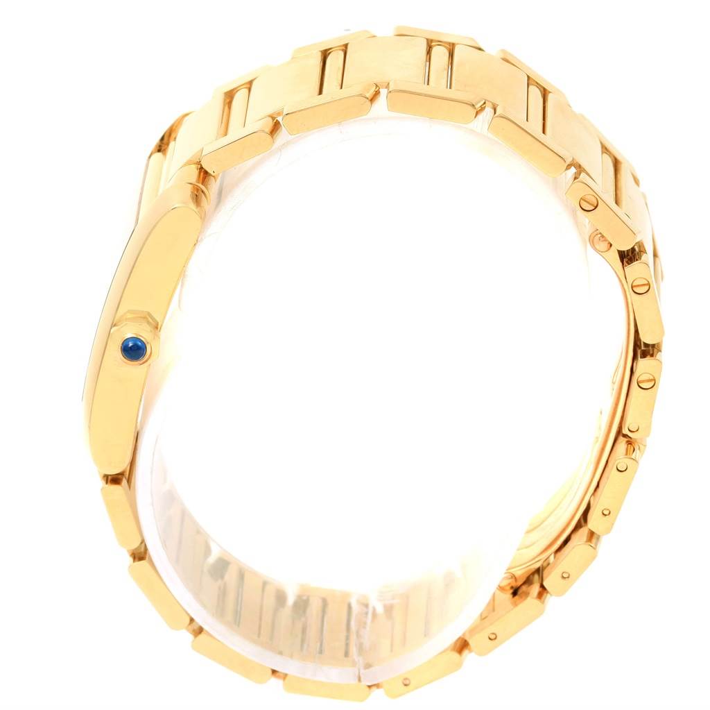 This image shows a Cartier Tank Francaise W50003N2 Women's Yellow Gold Silver Dial W50003N2 Women's Yellow Gold Silver Dial watch from a side angle, highlighting its gold bracelet and crown with a blue gemstone.