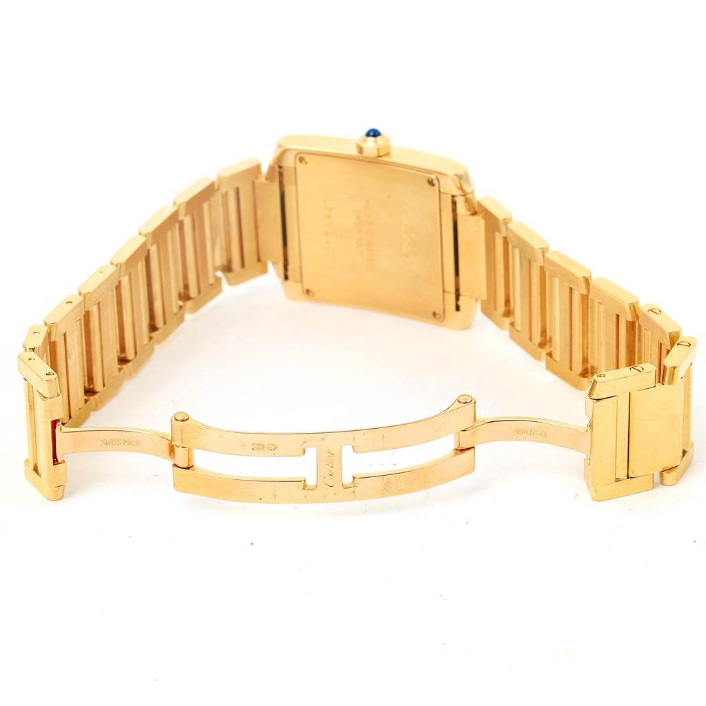 The image shows the back and clasp of a Cartier Tank Francaise W50003N2 Women's Yellow Gold Silver Dial W50003N2 Women's Yellow Gold Silver Dial watch in gold.