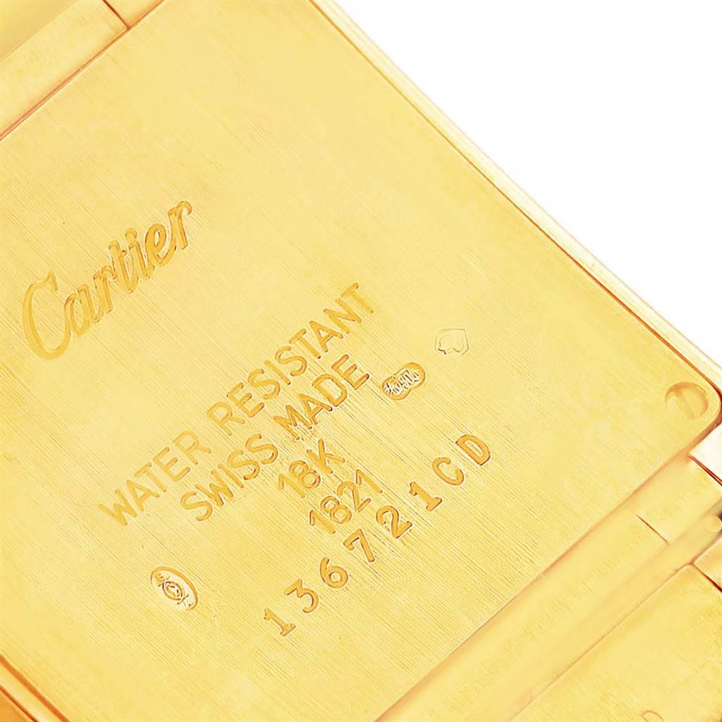 The image shows the back of the Cartier Tank Francaise W50003N2 Women's Yellow Gold Silver Dial W50003N2 Women's Yellow Gold Silver Dial watch, highlighting engravings and specifications.