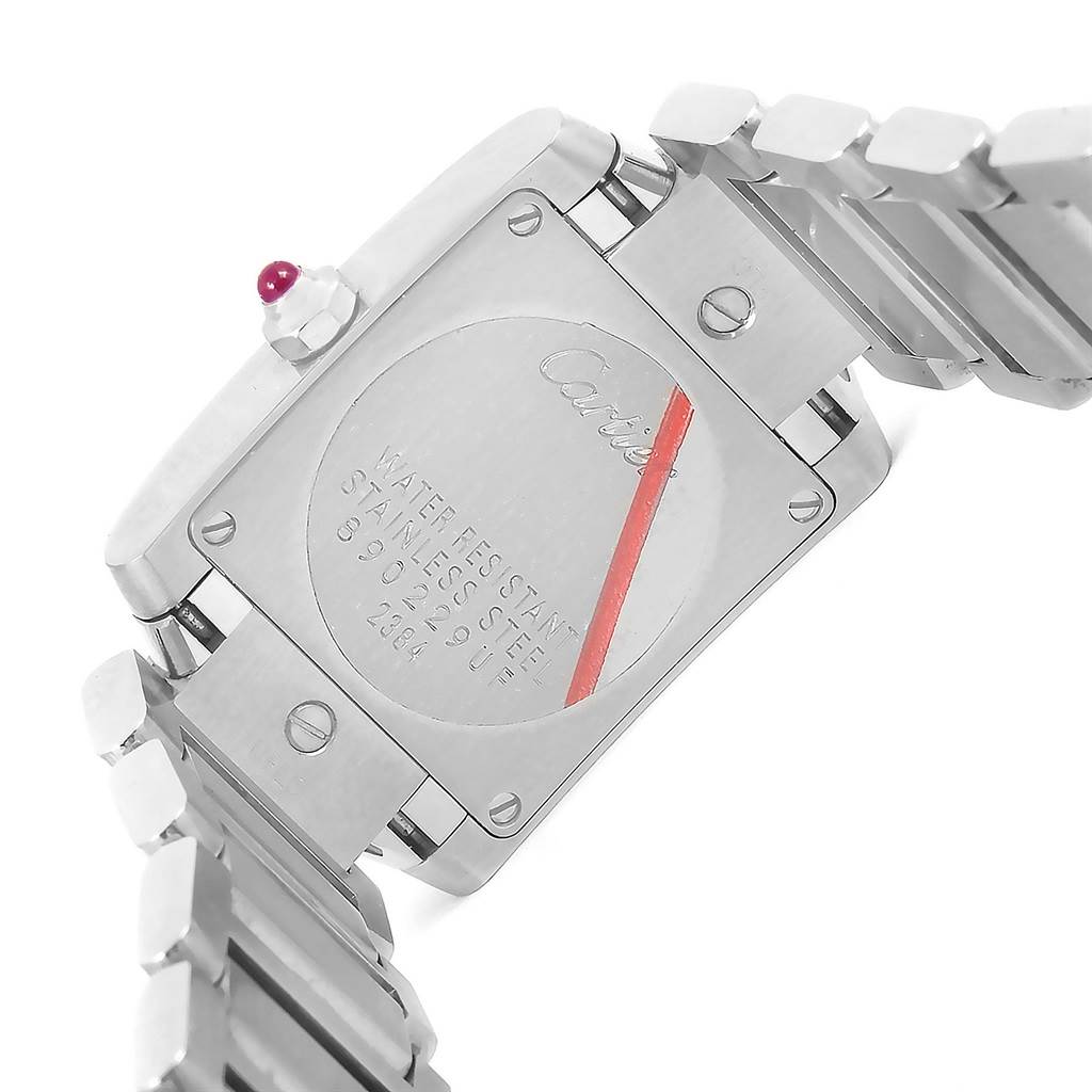 The image shows the back case and stainless steel bracelet of a Cartier Tank Française watch.