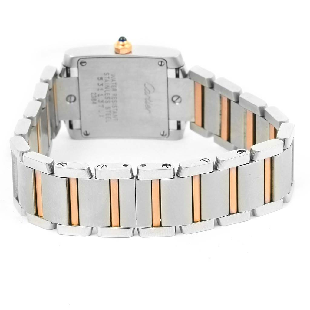 This Tank Francaise model by Cartier is shown from the back angle, detailing the case back and the bracelet with metal links.