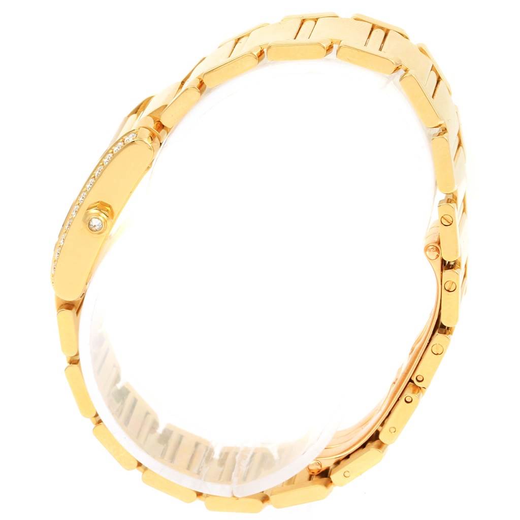 The image shows a side view of the Cartier Tank Française watch, focusing on its gold bracelet and diamond-studded case.