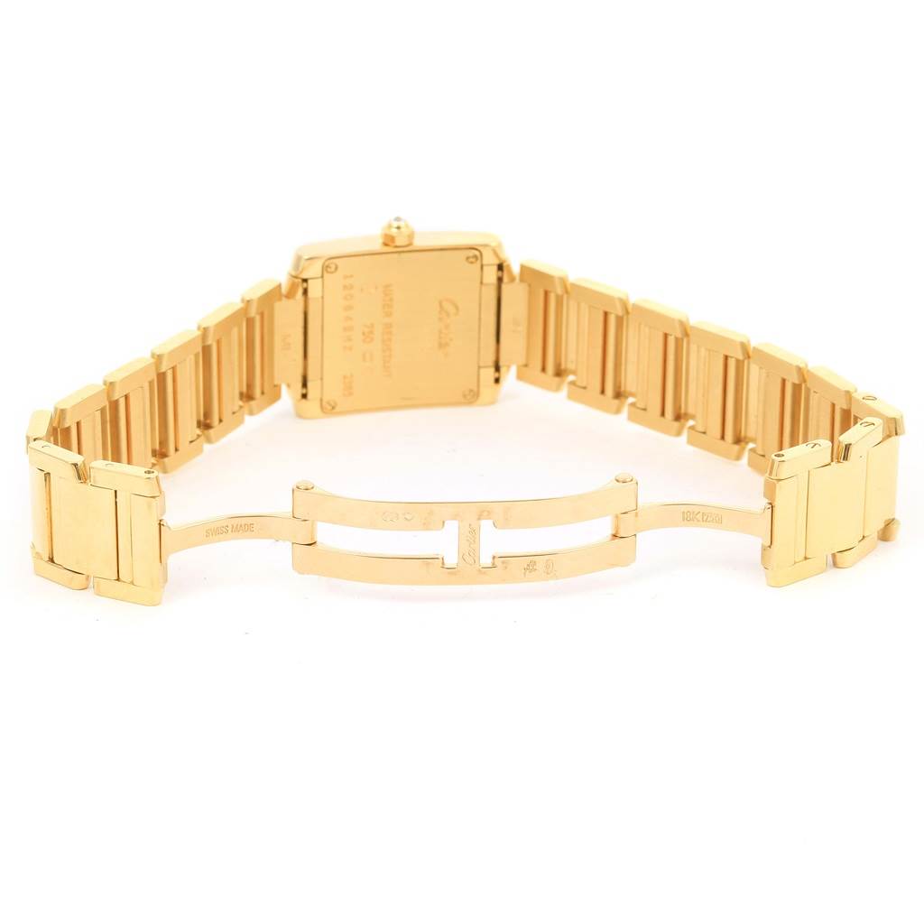 The image shows the back view of a Cartier Tank Francaise WE1001R8 Women's Yellow Gold Silver Dial WE1001R8 Women's Yellow Gold Silver Dial watch, focusing on the case back and the bracelet clasp.