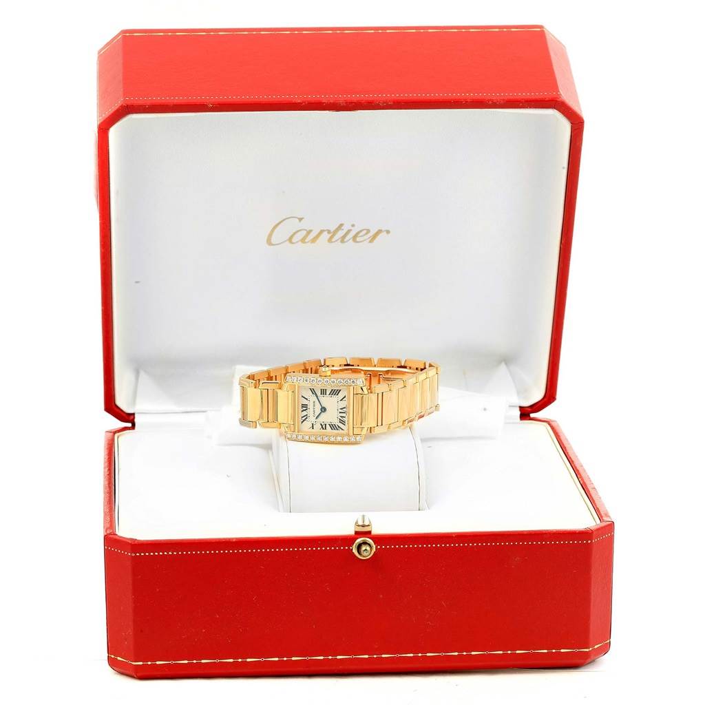 The Cartier Tank Francaise WE1001R8 Women's Yellow Gold Silver Dial WE1001R8 Women's Yellow Gold Silver Dial watch is shown inside its red branded box, facing front with its bracelet fully visible.