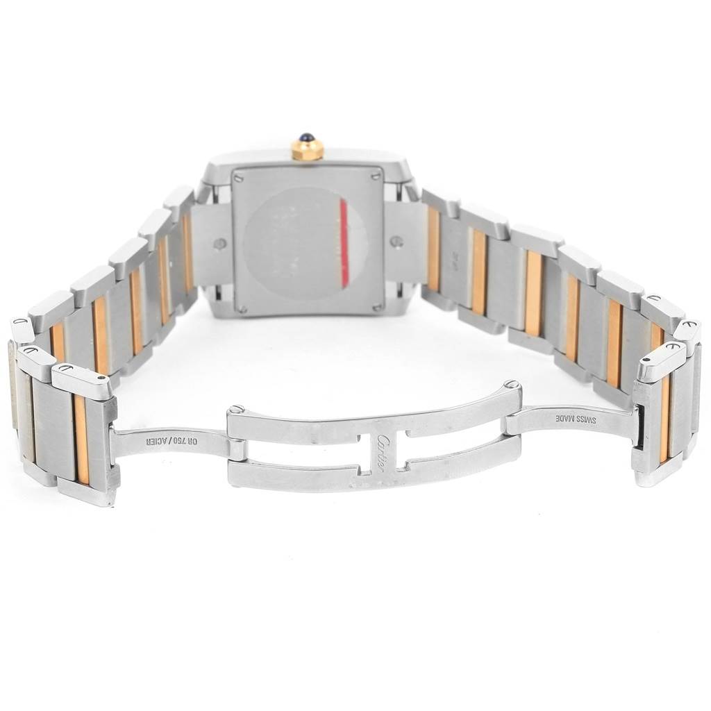 This image shows the back of a Cartier Tank Française watch with its bracelet and clasp open.