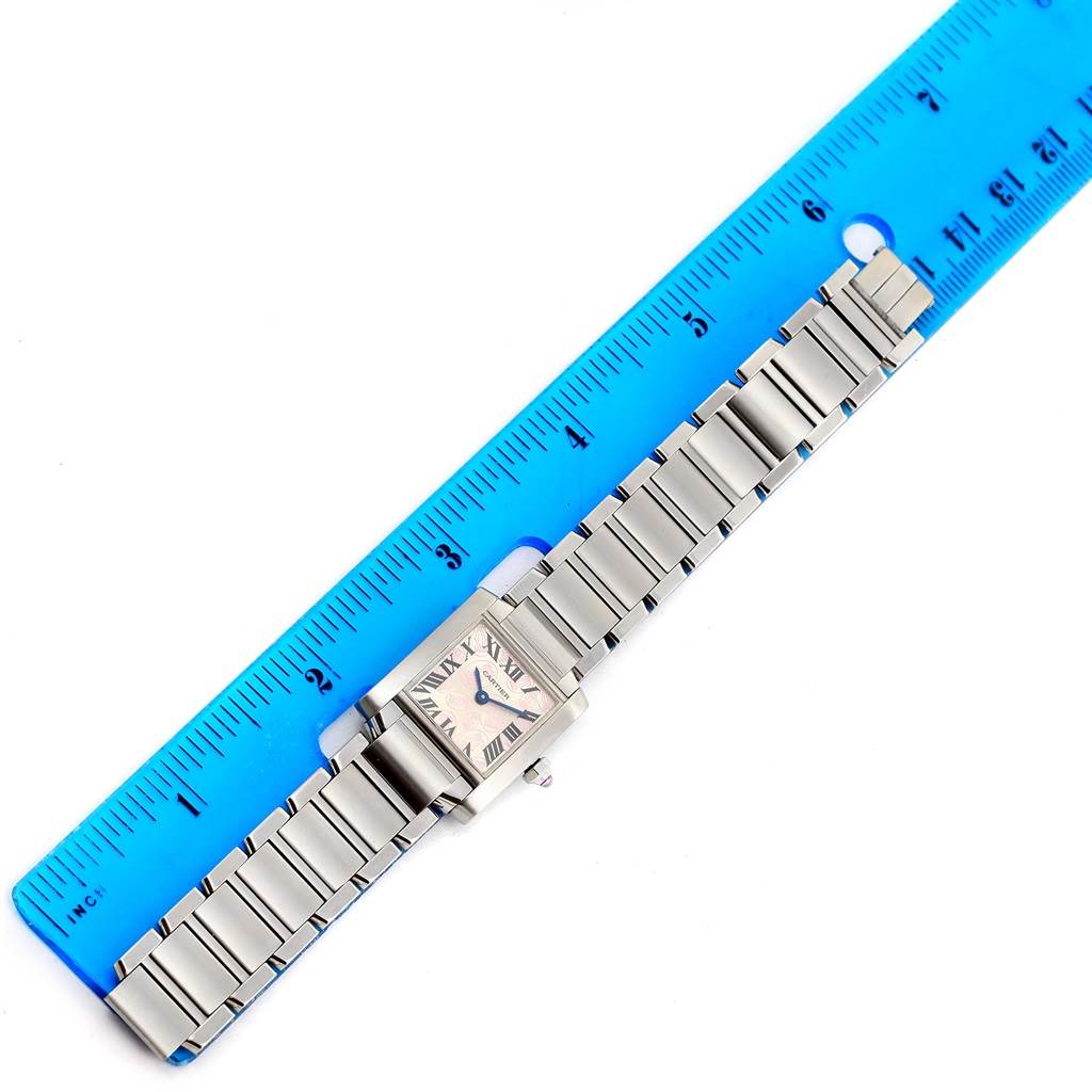 The Cartier Tank Francaise W51031Q3 Women's Stainless Steel Silver Dial W51031Q3 Women's Stainless Steel Silver Dial watch is shown from above, with its entire face, bracelet, and a blue measuring ruler for scale.