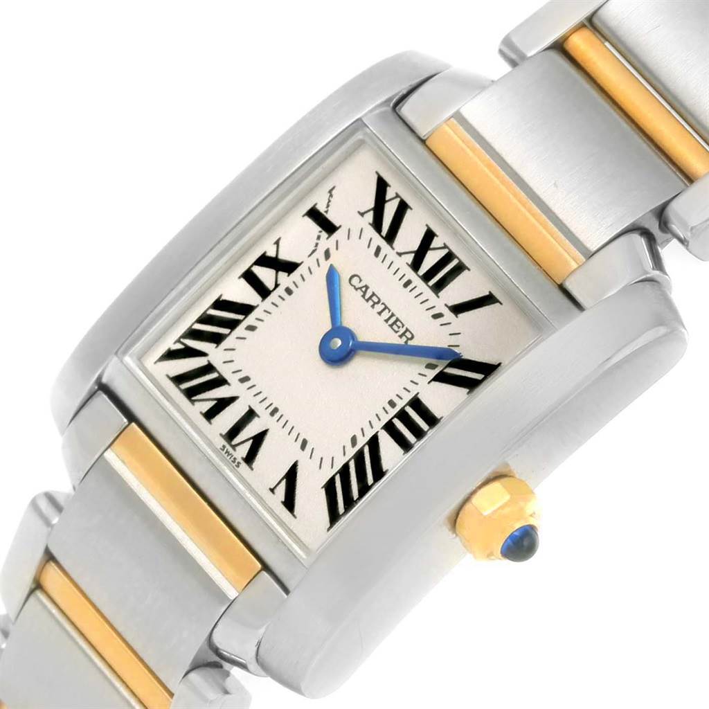 The image shows a close-up of a Cartier Tank Française watch face, crown, and part of the bracelet at an angled view.