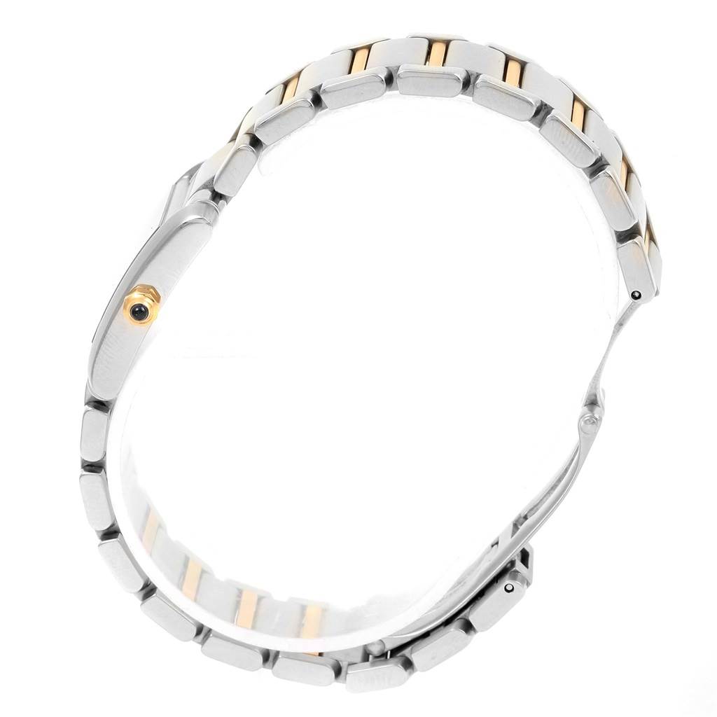 This image shows a side view of the Tank Francaise watch by Cartier, highlighting its metal bracelet and crown.