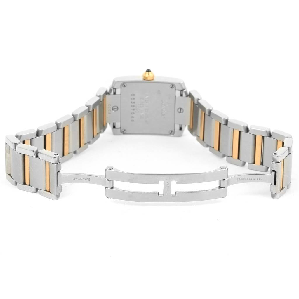 The image shows the backside of a Cartier Tank Francaise W51007Q4 Women's Steel and Gold (two tone) Silver Dial W51007Q4 Women's Steel and Gold (two tone) Silver Dial watch, displaying the case back and open two-tone metal bracelet.