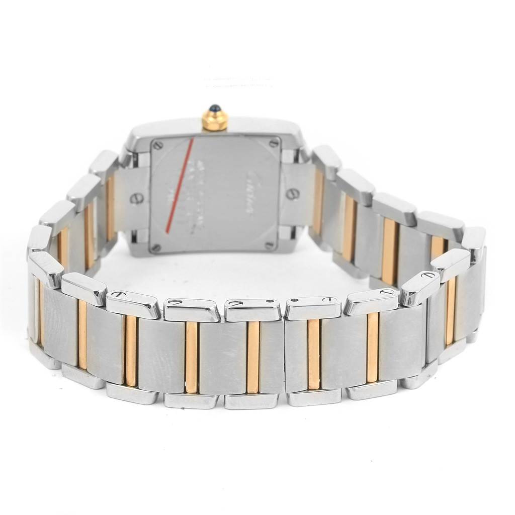 This image shows the back view of a Tank Francaise model by Cartier, highlighting the metal bracelet with gold accents.