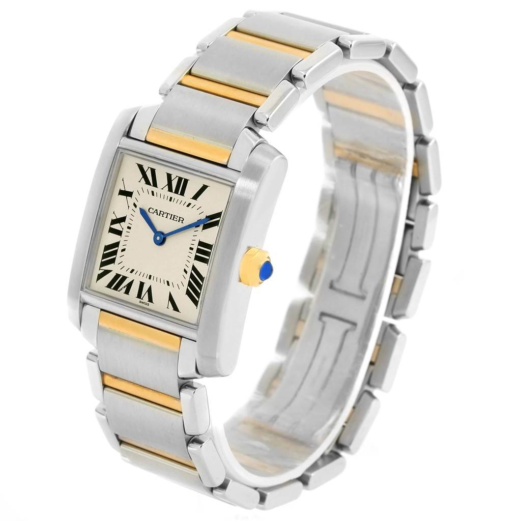 This is a Cartier Tank Francaise W2TA0003 Women's Steel and Gold (two tone) Silver Dial W2TA0003 Women's Steel and Gold (two tone) Silver Dial watch showing the face, bracelet, and crown at an angled perspective.