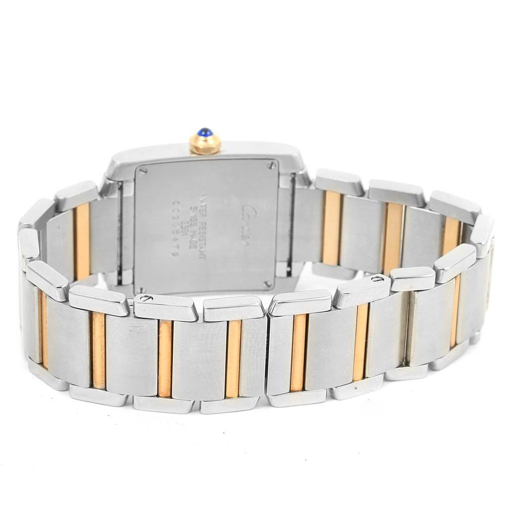 The image shows the back of a Cartier Tank Francaise W2TA0003 Women's Steel and Gold (two tone) Silver Dial W2TA0003 Women's Steel and Gold (two tone) Silver Dial watch, highlighting its two-tone metal bracelet and case back.