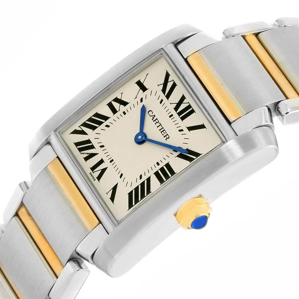 This image shows a close-up angled view of the Cartier Tank Francaise W2TA0003 Women's Steel and Gold (two tone) Silver Dial W2TA0003 Women's Steel and Gold (two tone) Silver Dial watch, highlighting its face, bezel, and part of the two-tone bracelet.