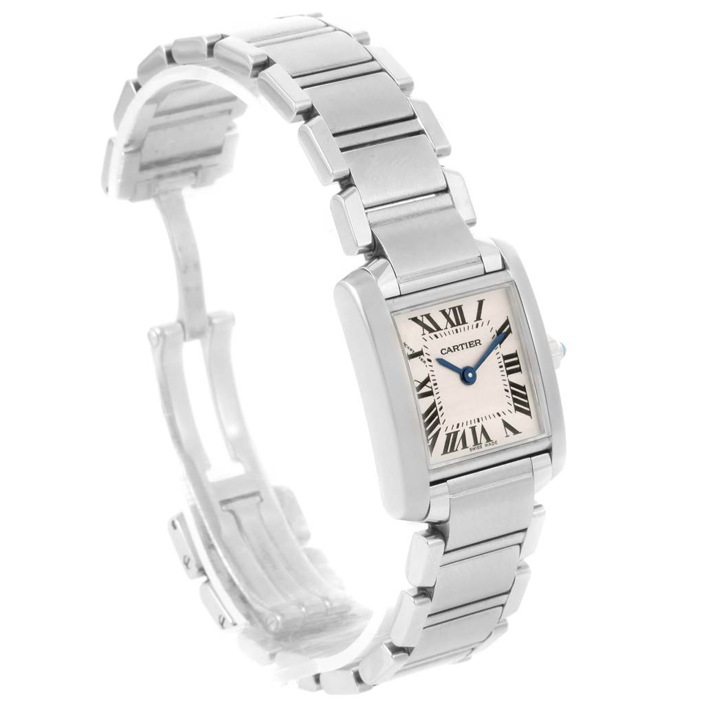 The Cartier Tank Française watch is shown at an oblique angle, displaying its rectangular face, Roman numerals, and silver bracelet.