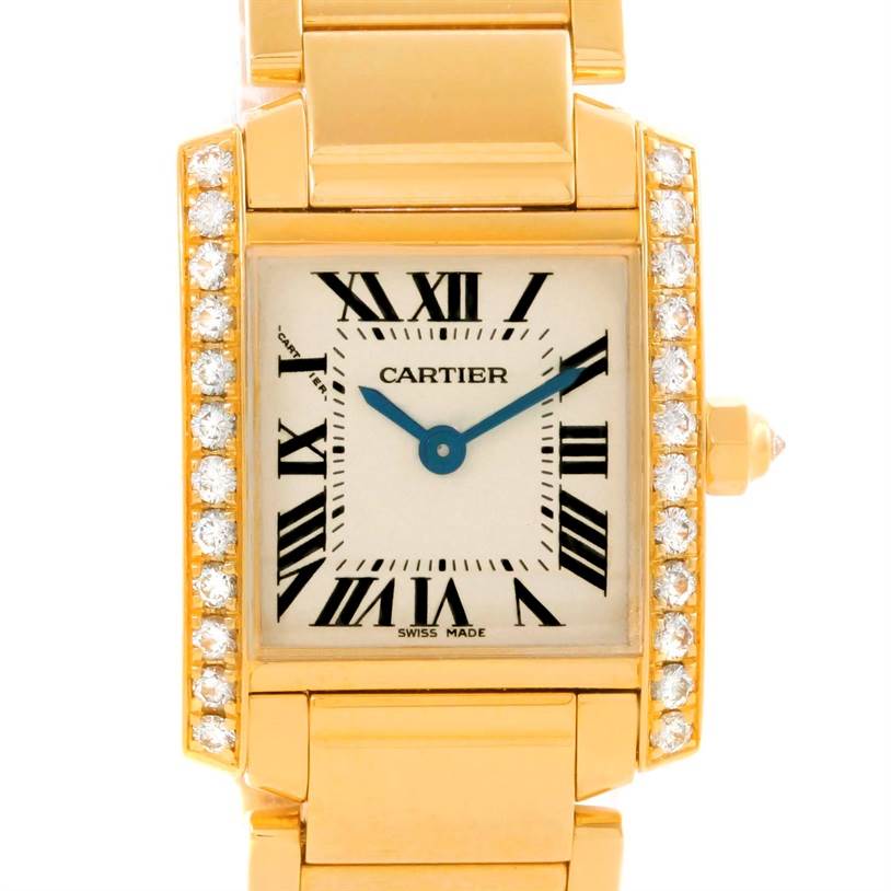 This image shows a Cartier Tank Française watch with a frontal view of its gold case, diamond-set bezel, dial, and part of the bracelet.