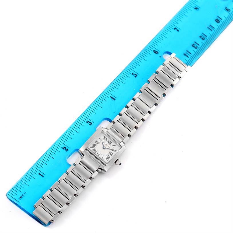 The Cartier Tank Francaise W51008Q3 Women's Stainless Steel Silver Dial W51008Q3 Women's Stainless Steel Silver Dial watch is shown from a top-down angle with a ruler beside it for scale.