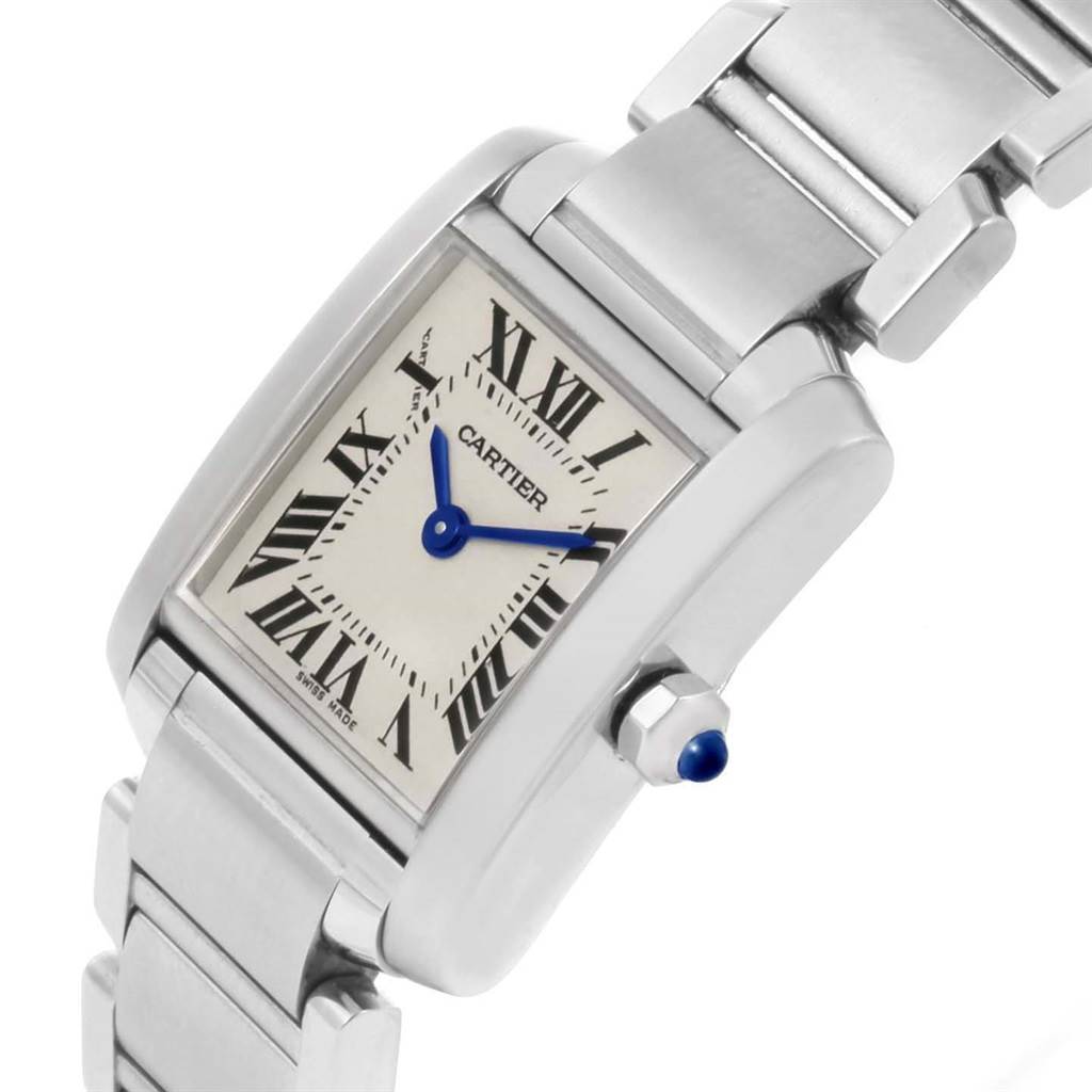 The image shows a close-up side angle of a Cartier Tank Française watch, highlighting its face, bezel, and part of the bracelet.