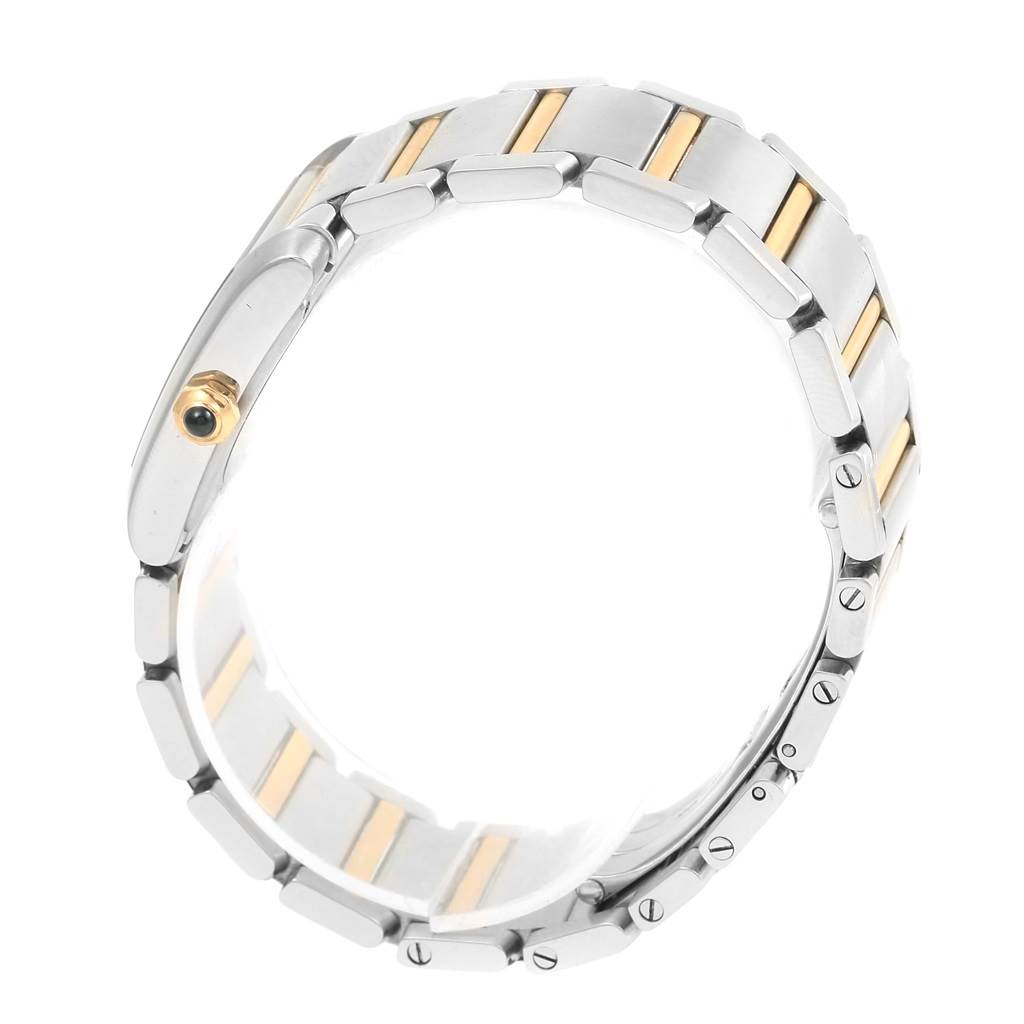 The photo shows a side view of the bracelet of a Cartier Tank Francaise W51012Q4 Women's Steel and Gold (two tone) Silver Dial W51012Q4 Women's Steel and Gold (two tone) Silver Dial watch, highlighting its two-tone metal links and crown.