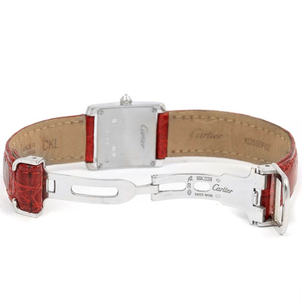 The image shows the back of a Cartier Tank Francaise WE100231 Women's White Gold Silver Dial WE100231 Women's White Gold Silver Dial watch, highlighting its red leather strap and deployment clasp.