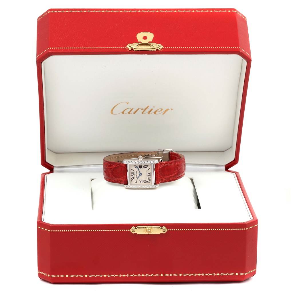 The Cartier Tank Francaise WE100231 Women's White Gold Silver Dial WE100231 Women's White Gold Silver Dial watch is shown front-facing inside an open red Cartier box.