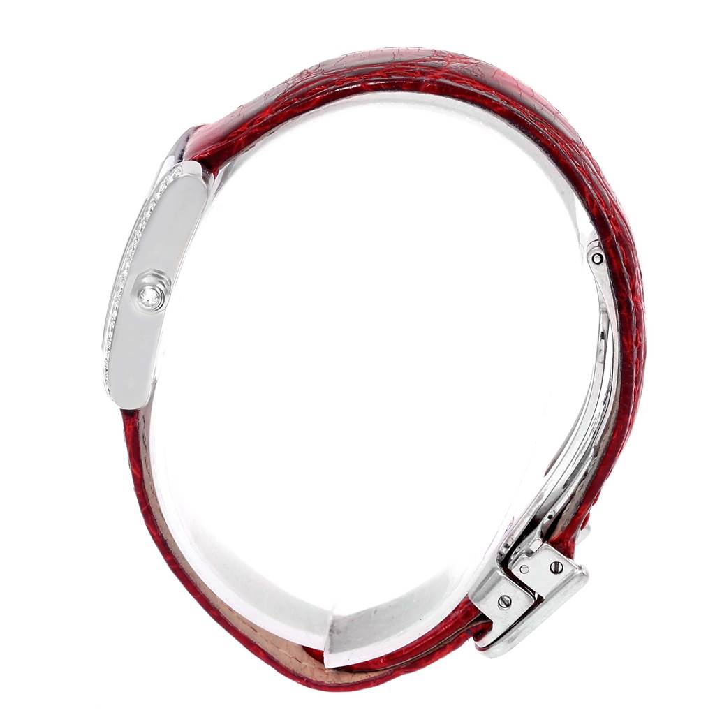 The Cartier Tank Francaise WE100231 Women's White Gold Silver Dial WE100231 Women's White Gold Silver Dial watch is shown from a side view, highlighting the red leather strap and clasp.