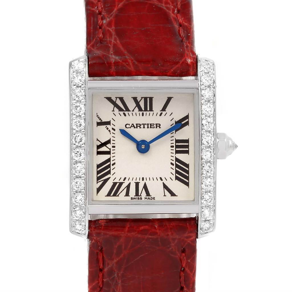 The image shows a front view of the Cartier Tank Francaise WE100231 Women's White Gold Silver Dial WE100231 Women's White Gold Silver Dial watch face and its red leather strap.