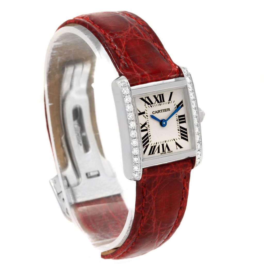 The image shows a Cartier Tank Française watch from a front angle, highlighting its red leather strap, rectangular dial, and diamond-encrusted bezel.