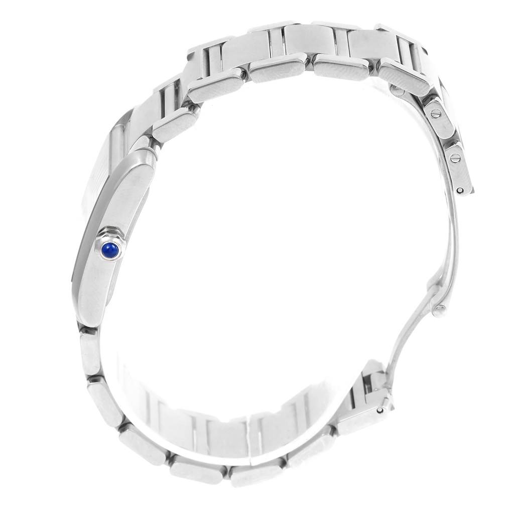 The image shows a side view of the Cartier Tank Francaise W51011Q3 Women's Stainless Steel Silver Dial W51011Q3 Women's Stainless Steel Silver Dial watch, emphasizing the metal band and the crown with a blue cabochon.