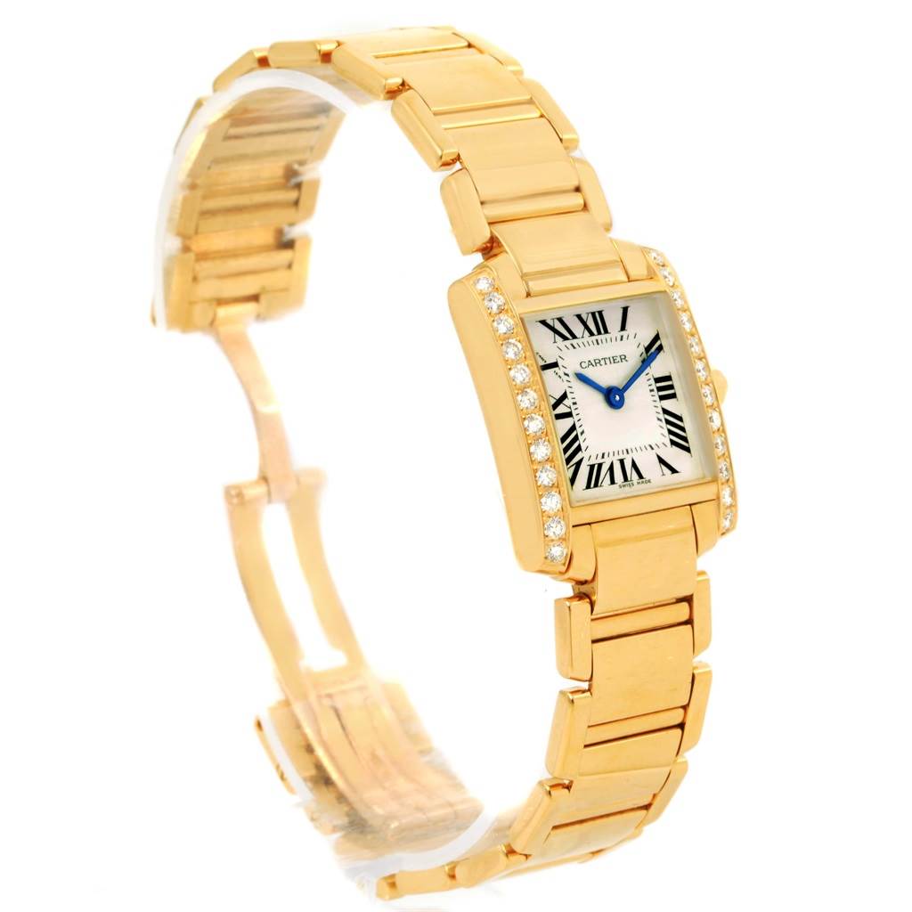 The image shows a Cartier Tank Française watch at a slight angle, highlighting its gold bracelet, rectangular face, and diamond-set bezel.