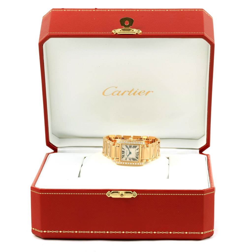 The Cartier Tank Francaise WE1001R8 Women's Yellow Gold Silver Dial WE1001R8 Women's Yellow Gold Silver Dial watch is displayed front-facing in an open red presentation box.