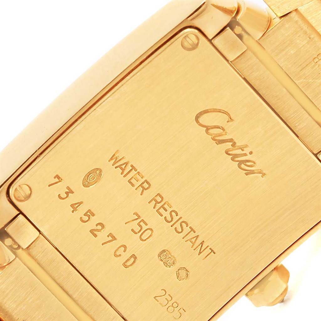 This image shows the back case and part of the bracelet of the Cartier Tank Française watch.
