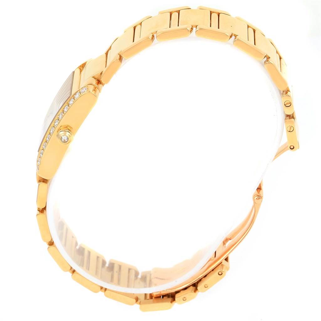 This image shows a side angle of a Cartier Tank Francaise WE1001R8 Women's Yellow Gold Silver Dial WE1001R8 Women's Yellow Gold Silver Dial watch, highlighting the gold bracelet and diamond-set bezel.