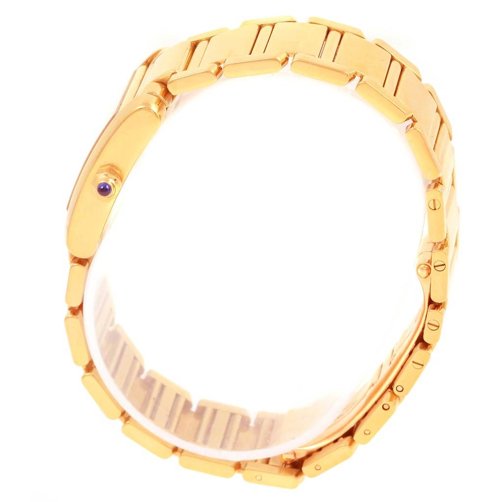 This image shows a side view of the gold strap and side profile of the Tank Francaise model by Cartier.