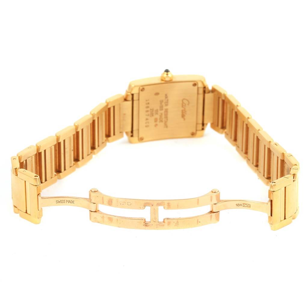 This image shows the back view of a Cartier Tank Francaise W50002N2 Women's Yellow Gold Silver Dial W50002N2 Women's Yellow Gold Silver Dial watch, highlighting the clasp and bracelet.