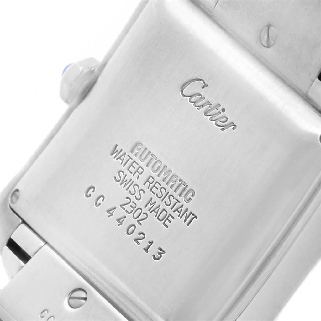 The image shows the back of the Cartier Tank Francaise W51002Q3 Stainless Steel Silver Dial W51002Q3 Stainless Steel Silver Dial watch, displaying its engravings and stainless steel casing.