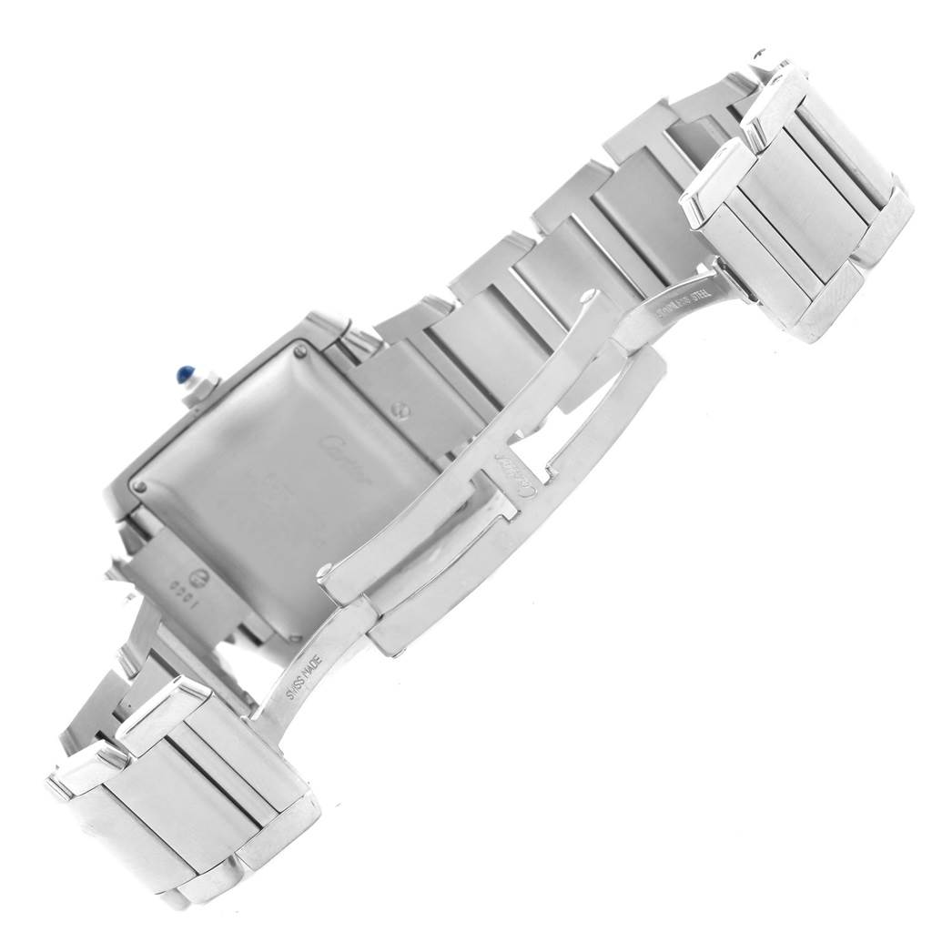 The image shows the back of a Tank Francaise model by Cartier, highlighting its clasp and bracelet.