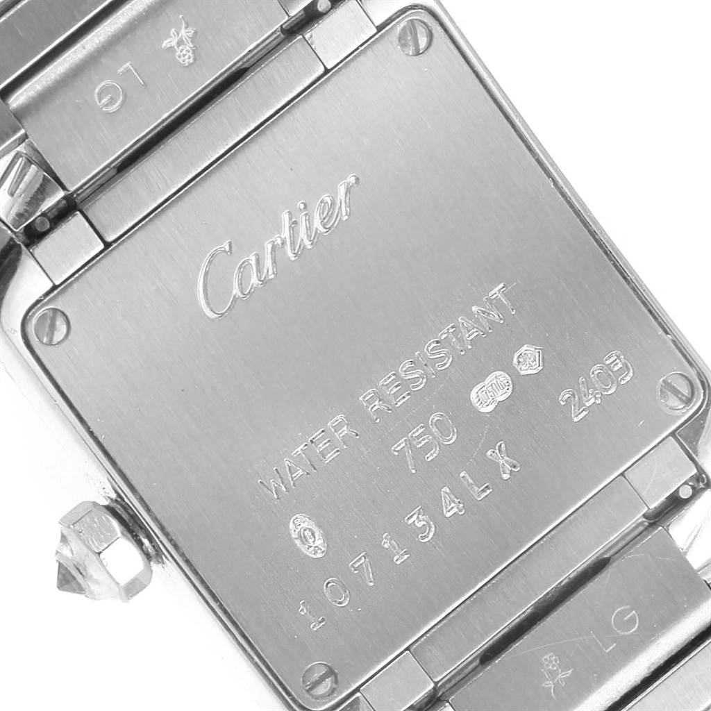The image shows the back case of a Cartier Tank Française watch, displaying engravings with brand, model, and specifications.