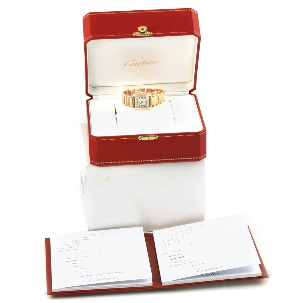 The image shows a Cartier Tank Française watch inside an open branded box, accompanied by booklets or certificates.