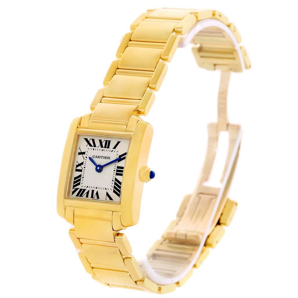 The image shows a Cartier Tank Française watch from a slightly tilted side angle, highlighting its gold case and bracelet with a clear view of the dial and crown.
