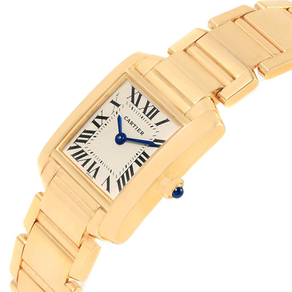 The Cartier Tank Francaise W50002N2 Women's Yellow Gold Silver Dial W50002N2 Women's Yellow Gold Silver Dial watch is shown at an angled close-up, displaying its face, dial, and part of the bracelet.
