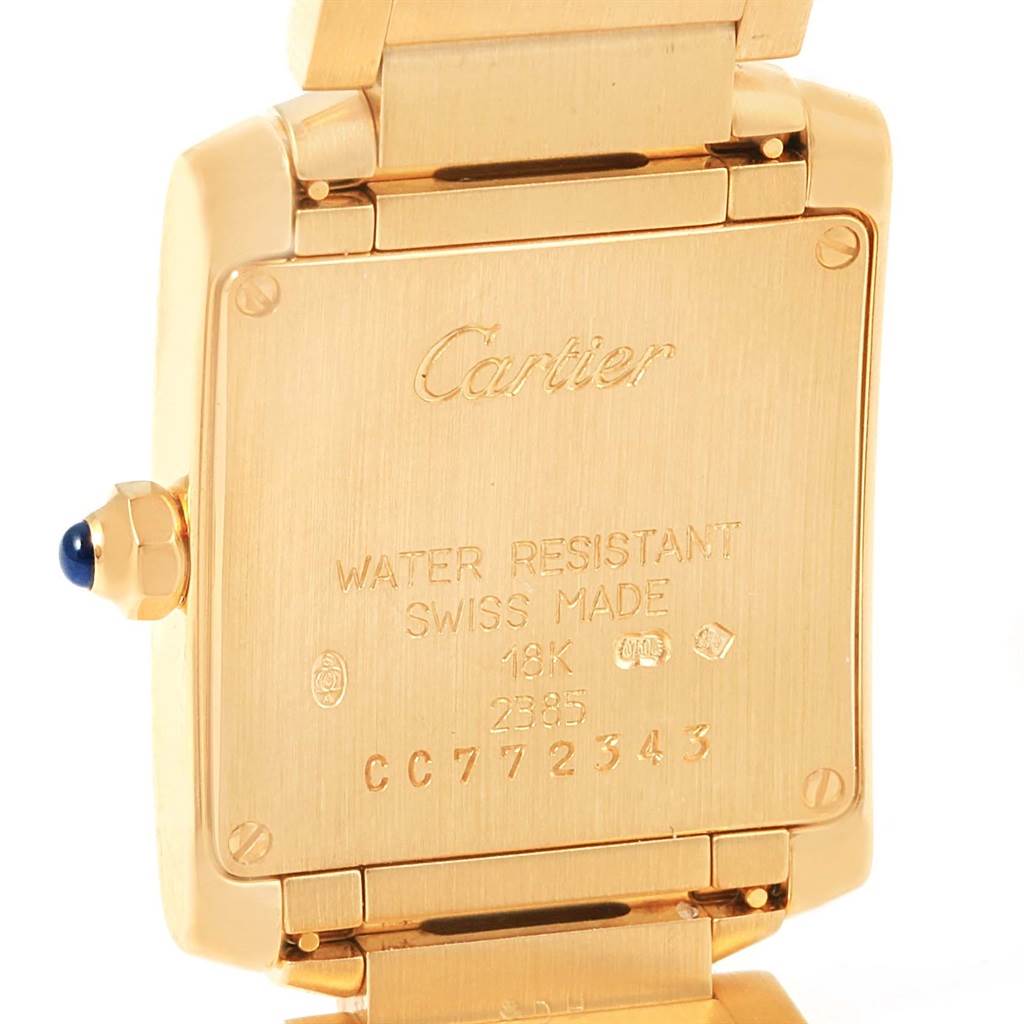 This image shows the back case and part of the bracelet of a Cartier Tank Française watch.