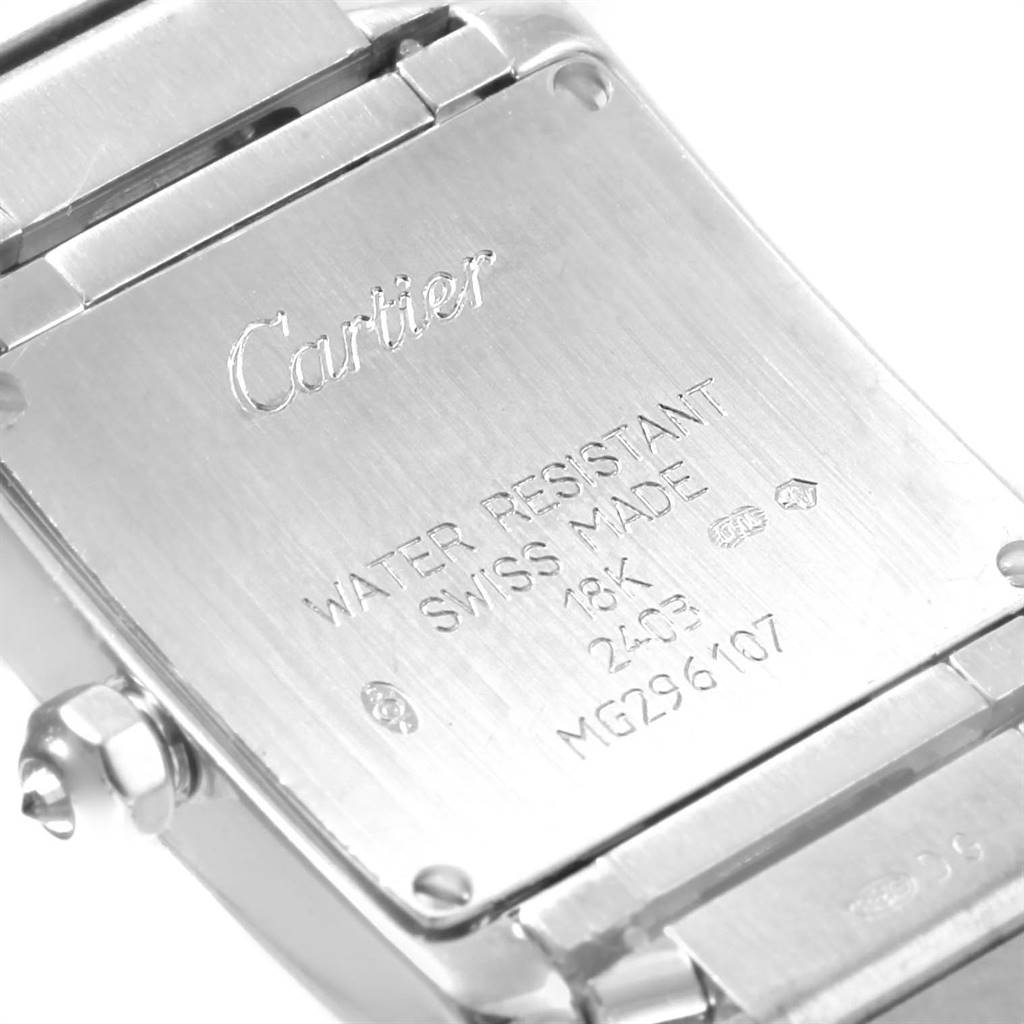 The image shows the back case of a Cartier Tank Française watch, displaying the brand name, model details, and some specifications.
