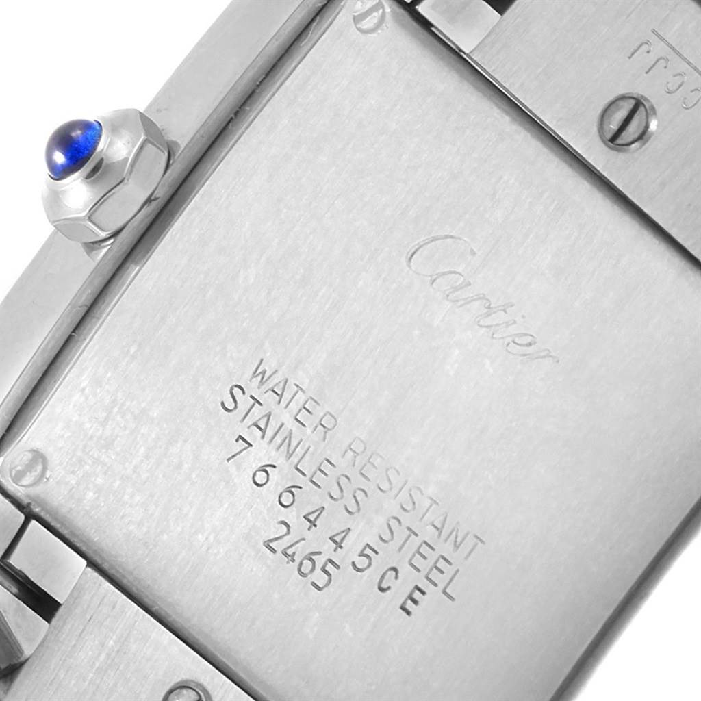 The image shows the stainless steel case back and crown of the Cartier Tank Francaise W51011Q3 Women's Stainless Steel Silver Dial W51011Q3 Women's Stainless Steel Silver Dial watch.