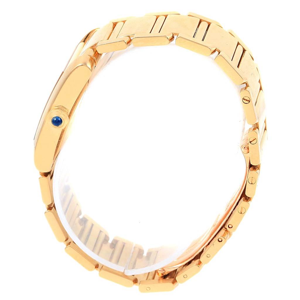 The image shows a side angle of the Cartier Tank Francaise W50014N2 Women's Yellow Gold Silver Dial W50014N2 Women's Yellow Gold Silver Dial watch, highlighting its gold bracelet and blue cabochon crown.