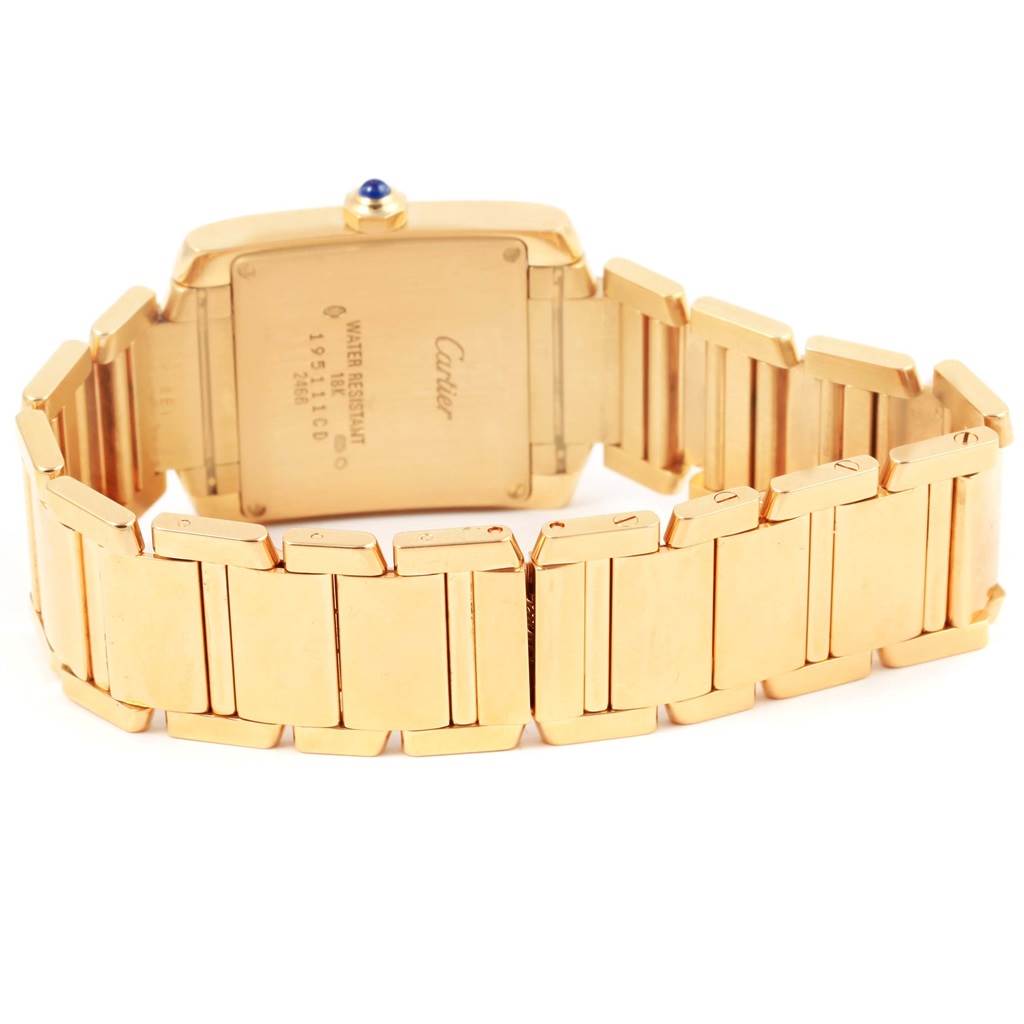 This image shows the back and band of a Cartier Tank Francaise W50014N2 Women's Yellow Gold Silver Dial W50014N2 Women's Yellow Gold Silver Dial watch, highlighting its gold finish and hallmark details.
