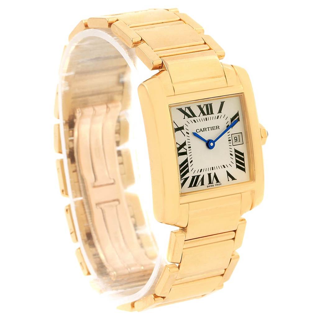 The image shows a Cartier Tank Francaise W50014N2 Women's Yellow Gold Silver Dial W50014N2 Women's Yellow Gold Silver Dial watch from an angled view, highlighting its rectangular dial, Roman numeral markers, and gold bracelet.