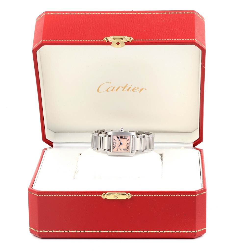 The Cartier Tank Française watch is displayed straight-on inside its open red presentation box.