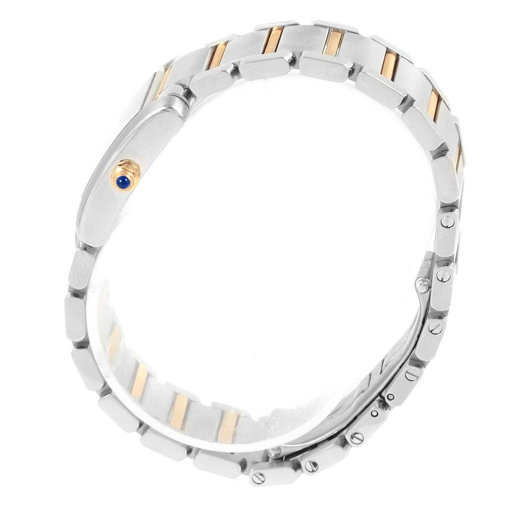 The image shows a side view of a Cartier Tank Francaise W51007Q4 Women's Steel and Gold (two tone) Silver Dial W51007Q4 Women's Steel and Gold (two tone) Silver Dial watch, focusing on its bracelet and crown.