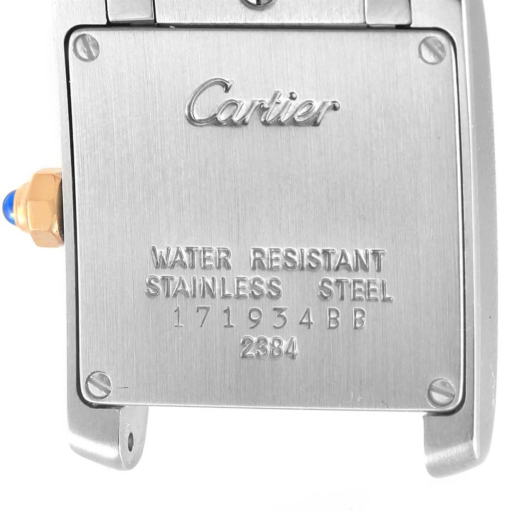 This is the back case of a Cartier Tank Française watch, showing the brand's engraving and model details.