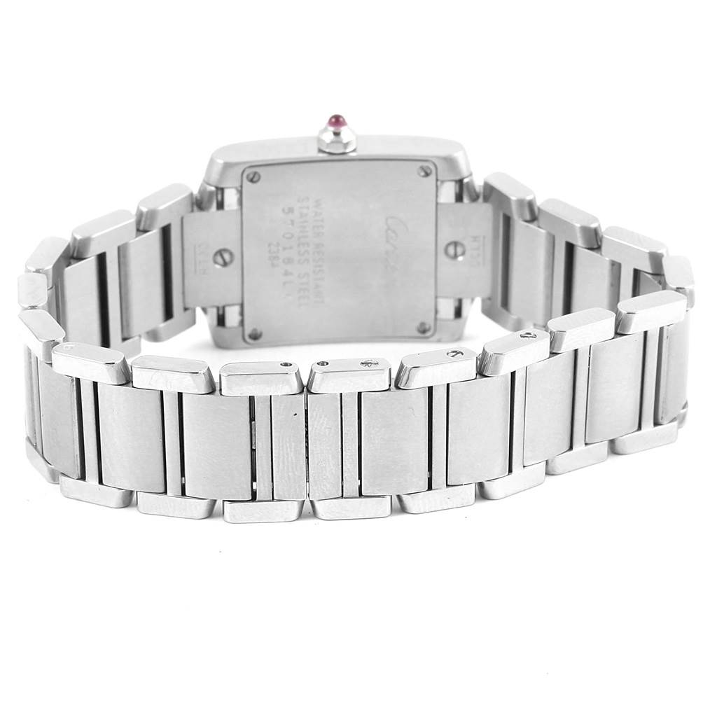 The image shows the back view of the Cartier Tank Française watch focusing on its stainless steel bracelet and case back.